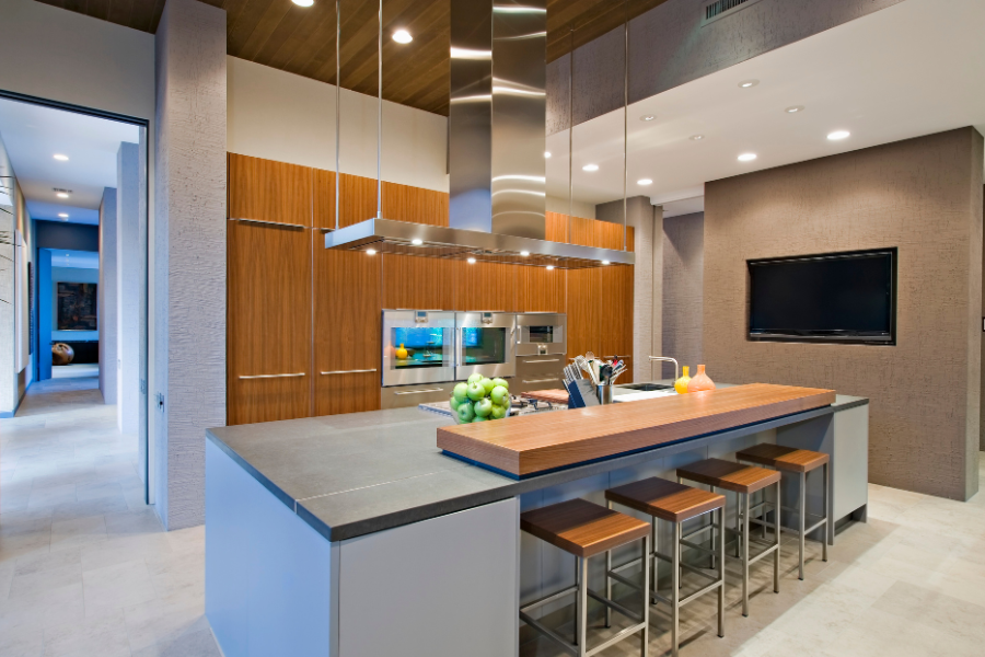 A beautifully desgined and organized modern kitchen with attached cooking and eating areas